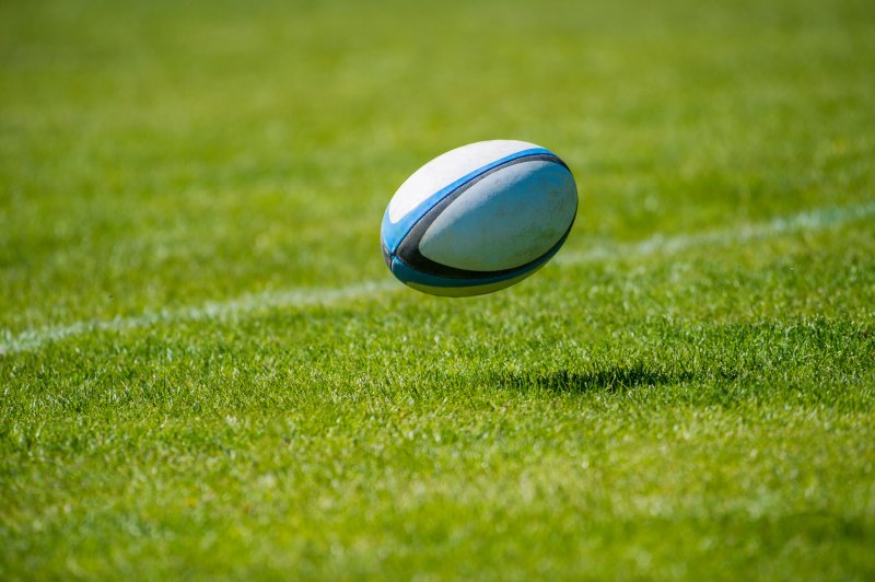 rugby ball on pitch, no players Stock Image