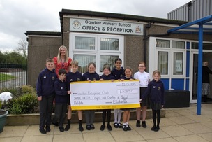 Enterprising pupils at Gawber Primary School with a cheque showing the £308 they made for a trip to Whitby.