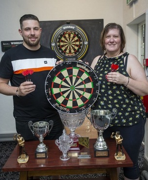 Main image for Mother and son sweep up in darts
