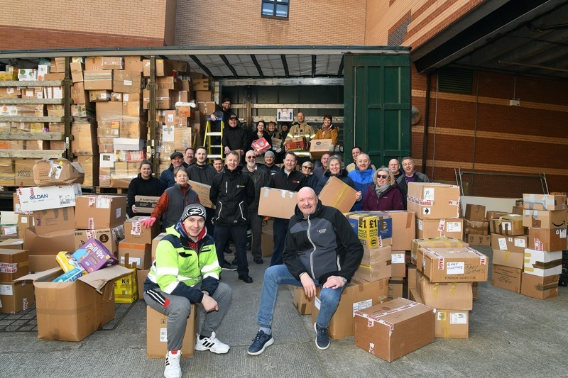 READY TO GO: From their Barnsley base at the Alhambra Centre Polish lorry driver Blaizie Kouchaivek (front left) and Henryk Matysiak (front right) prepare, along with the of help dozens of volunteers, to transport the hundreds of parcels of relief aid to the Ukranian refugees now teeming into Poland. Picture: Wes Hobson.  PD090885.