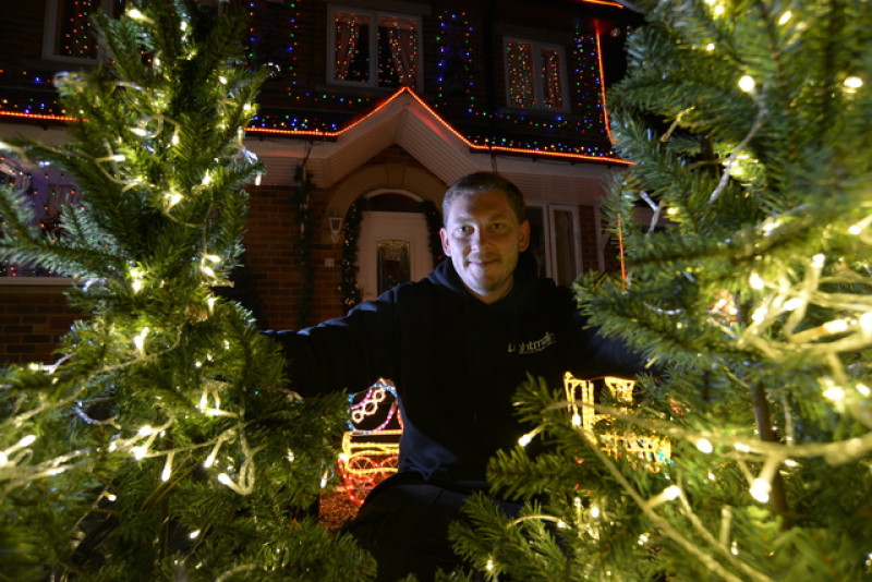 Main image for Christmas light show put on by fundraising man