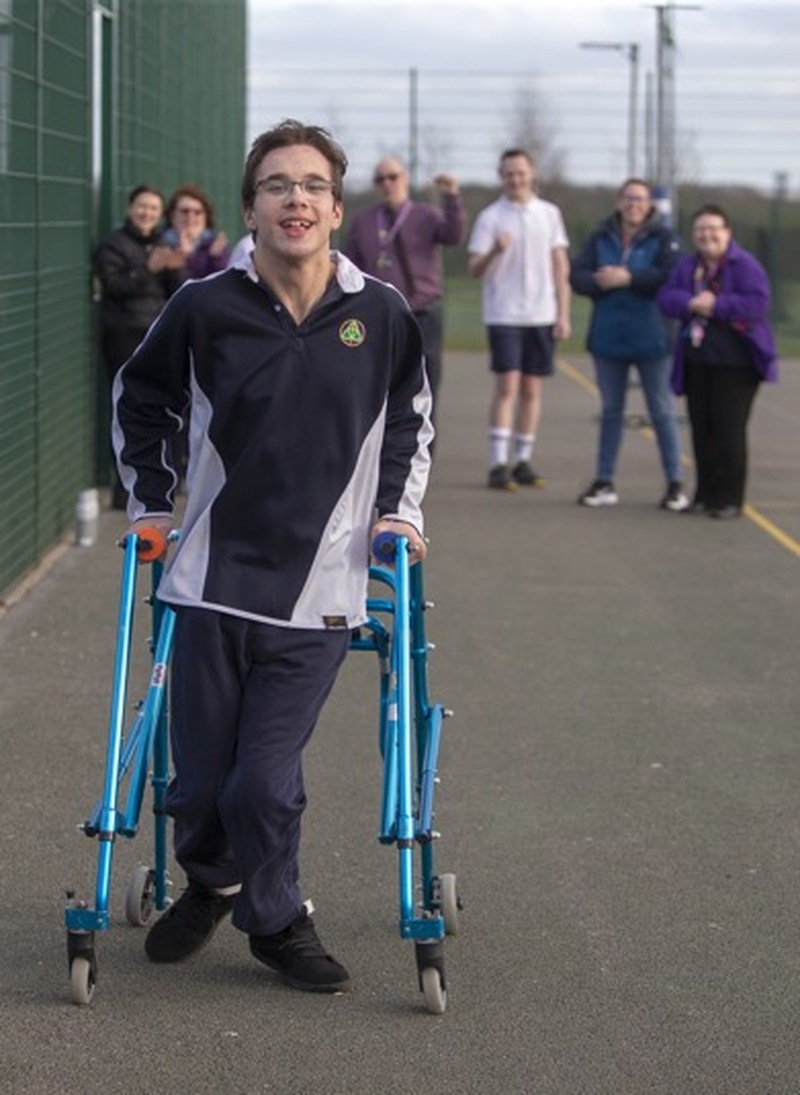 Main image for Dylan completes wheelchair-free walk for charity