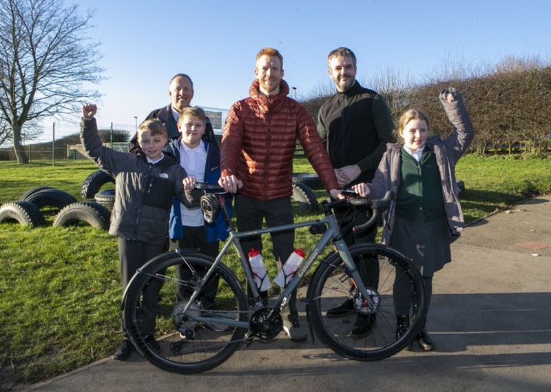 South Yorkshire Mayor Oliver Coppard, coun Robert Frost,with Ed Clancy OBE and active travel commissioner with pupils from  Springwood primary school Hoyland. Picture Shaun Colborn pd091861
