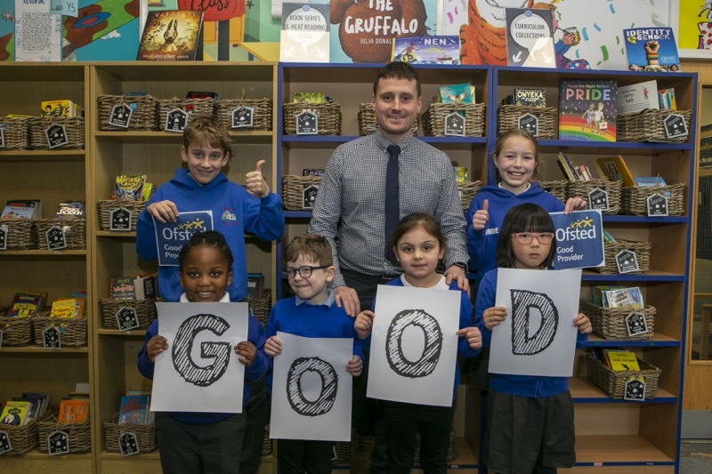 Good Report: Birdwell primary school headteacher Mr Honeyman with pupils showing off their good report. Picture Shaun Colborn PD091830