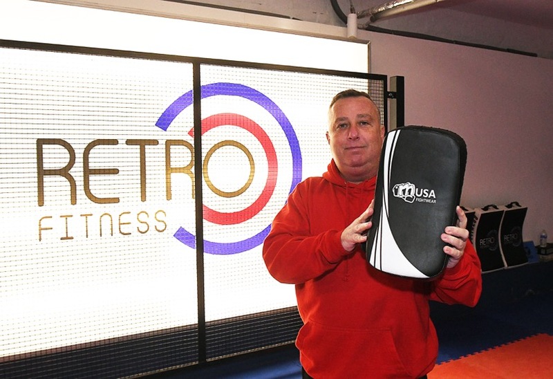 NEW STUFF: ‘Retro Fitnesse’s Charlie Green and some of his newly launched sports brand.  Picture: Wes Hobson.  PD091817.
