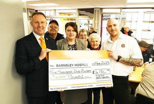 GREAT DONATION: Barnsley Hospice’s Simon Atkinson receives a cheque for £4170 from KM Travel’s Karen Speed and Matt Williams.  Picture: Wes Hobson.  PD091877.