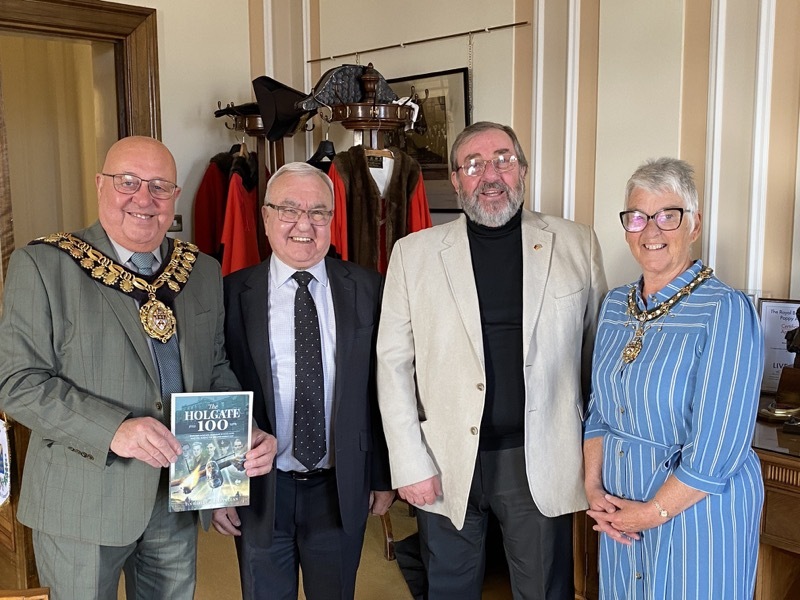 DONATION: Mayor Mick Stowe, his wife Elaine, and authors Ian Harley and Melvyn Lunn.