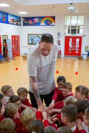 GENTLE GIANT: Former professional basketball player and Guinness World record holder 7’-7” Paul Sturgess visited the Ellis school hemingfield to motivate pupils and teachers. Picture Shaun Colborn PD092883