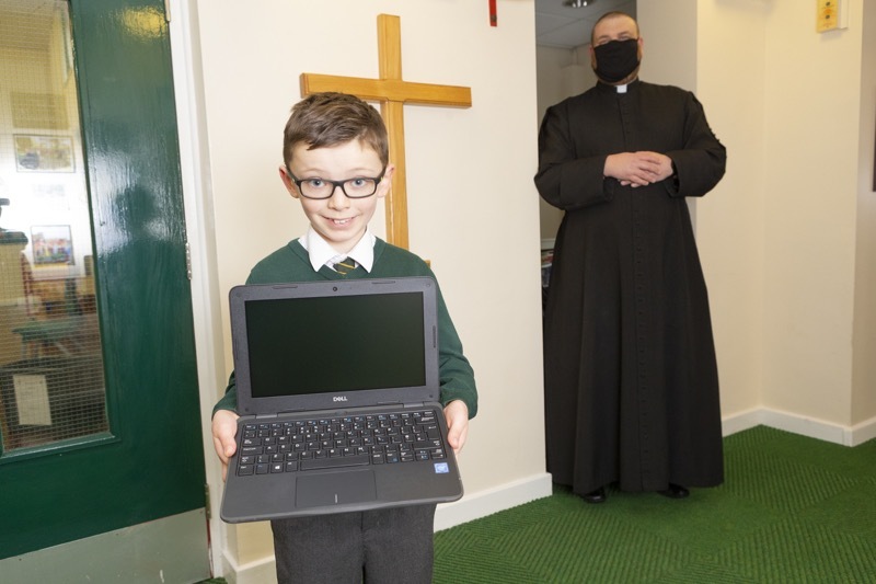 Main image for Laptops handed to Royston kids after priest’s campaign