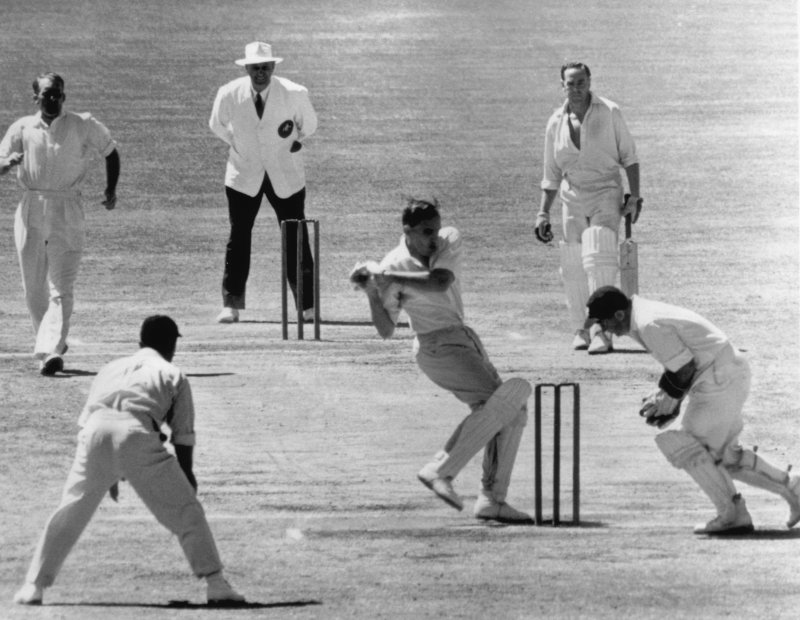 Ashes winner: Johnny Wardle, left, bowling for England in the 1955 Ashes in Adelaide. Picture: Hulton Archive/Getty Images.