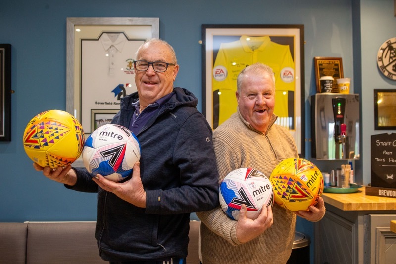 NEW BALLS: Mick Tonge father of Adrian Tonge hands over 8 new professional soccer footballs, to Houghton Main Groundsman Alan Haynes. Picture Shaun Colborn PD092817