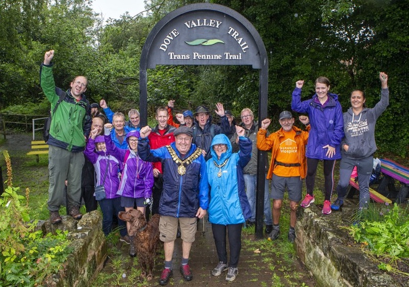 Charity Walk: Despite heavy rain, the mayor of Barnsley along with the council leader Sir Steve Houghton, MP Dan Jarvis, and other councillors completed a 23 mile walk from Dunford Bridge to pastures lodge in the Dearne in aid of the mayors charity. Picture Shaun Colborn PD092372