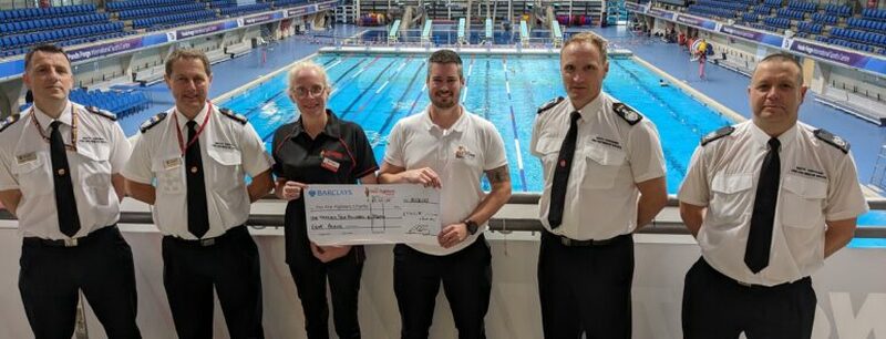 FUNDRAISER: Staff who took part in the scheme handing over a cheque.