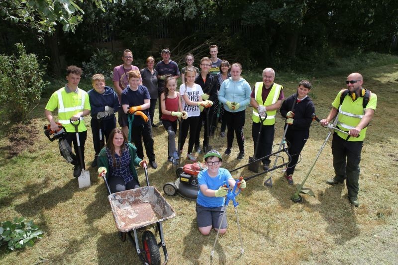 Main image for Pupils dig in to help create village memorial garden