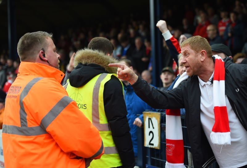 Main image for Reds’ fans clash with stewards in ugly scenes