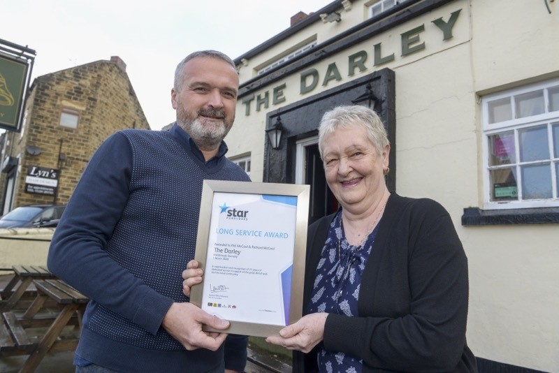 Main image for Pub duo receive long-service award