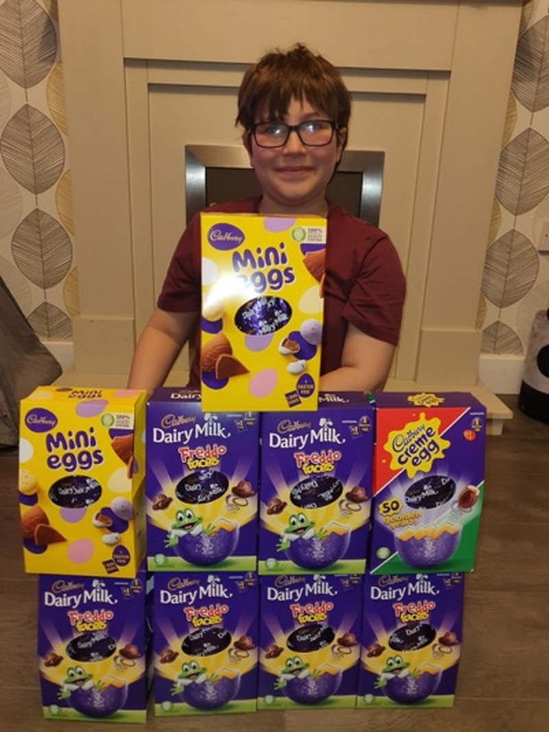 Main image for Kind youngster collects Easter eggs for classmates