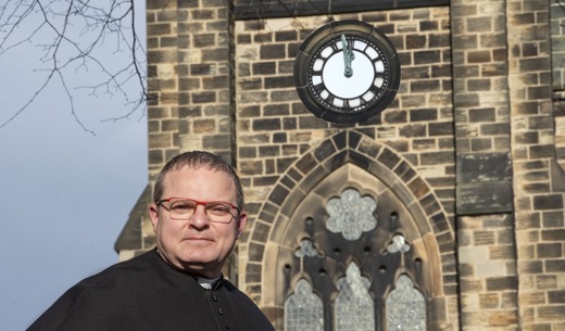 No Tick: Father Darren Percival with time standing still and at a cost of over £3,000 to get it going again at St Pauls Monk Bretton. Picture Shaun Colborn