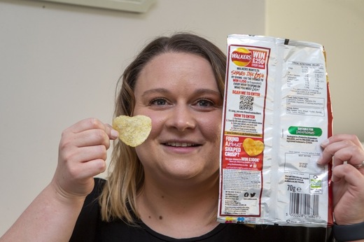 Charlotte Hubbard from Gawber with her heart shaped Walkers crisp, picture Shaun Colborn PD091996