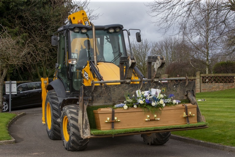 Funeral Digger: Arriving in a JCB was one of Ian Jackson’s last request, for the late builder. Picture Shaun Colborn PD092004