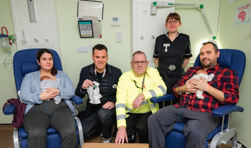 Alba Ojeda Corujo and baby Luca, Keith Jackson (Tesco Communications Manager), Dave Chambers (Salvation Army Lead Collector), Tracey James (Lead Nurse) and Matteo Ojeda Corjuo and baby, Pablo.