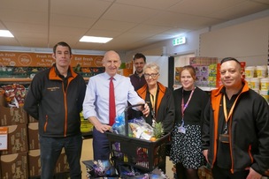 TEN YEARS DOWN: John Healey MP with Owen McLellan, managing director at Company Shop, Coun Abi Moore, store manager Mark Howorth, supervisor Gareth Pridham and shopworker Gill Murch.