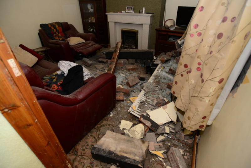 Main image for Woman has miraculous escape after car ploughs into house