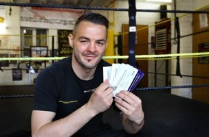 Main image for Boxer Josh signs tickets to thank fans