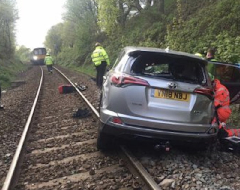 Main image for Car on railway line causes travel chaos