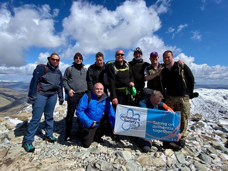 Main image for Bus drivers climb mountain for charity