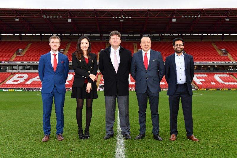 CHANGED: The Barnsley owners at Oakwell after the sale went through in 2017. From left to right: James Cryne, Grace Hung, Paul Conway, Chien Lee and Neerav Parekh.