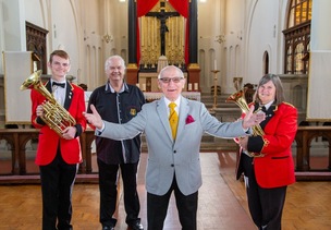 HARMONY AT BRASS: Thurnscoe Male Harmonic Voice Choir and the Barnsley Metropolitan Band join forces for a concert at Goldthorpe’s St John and Mary Magdalene church, pictured are Conductor Tony Jermy, Paul Thomas, Gillian Thomas and Finlay Spencer PD093133