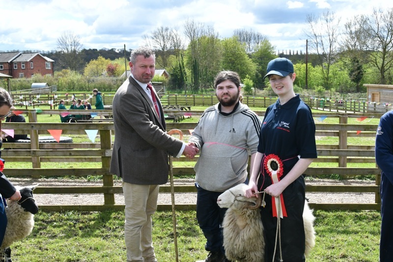 WINNER: Richard Walker (left) with students Presley Beckham and Victoria Walker with their winning sheep.