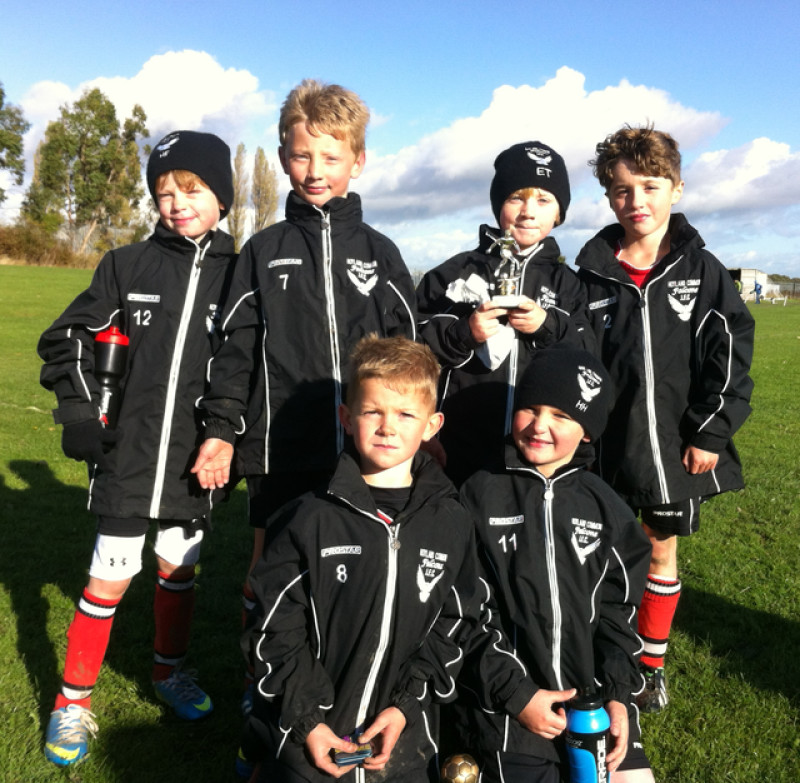 Main image for Junior football team given jackets to keep out icy blasts