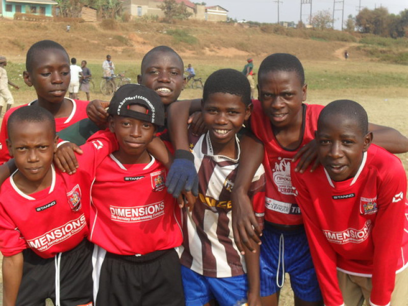 Main image for 'Emotional return' to Africa for Clem who distributes football kits