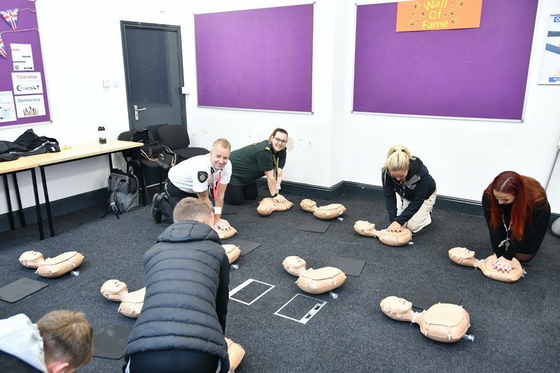 LIFE-SAVING: Students learning how to do CPR.