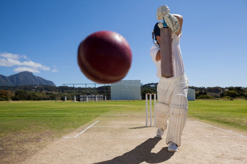 Cricket ball being batted towards camera Stock Image